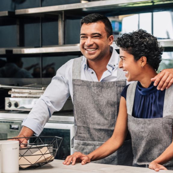 Employer with arm around Employee, highlighting Commercial Insurance